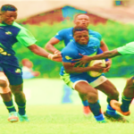 Festus Shiasi with ball of KCB RFC is tackled by Kabras Sugar RFC